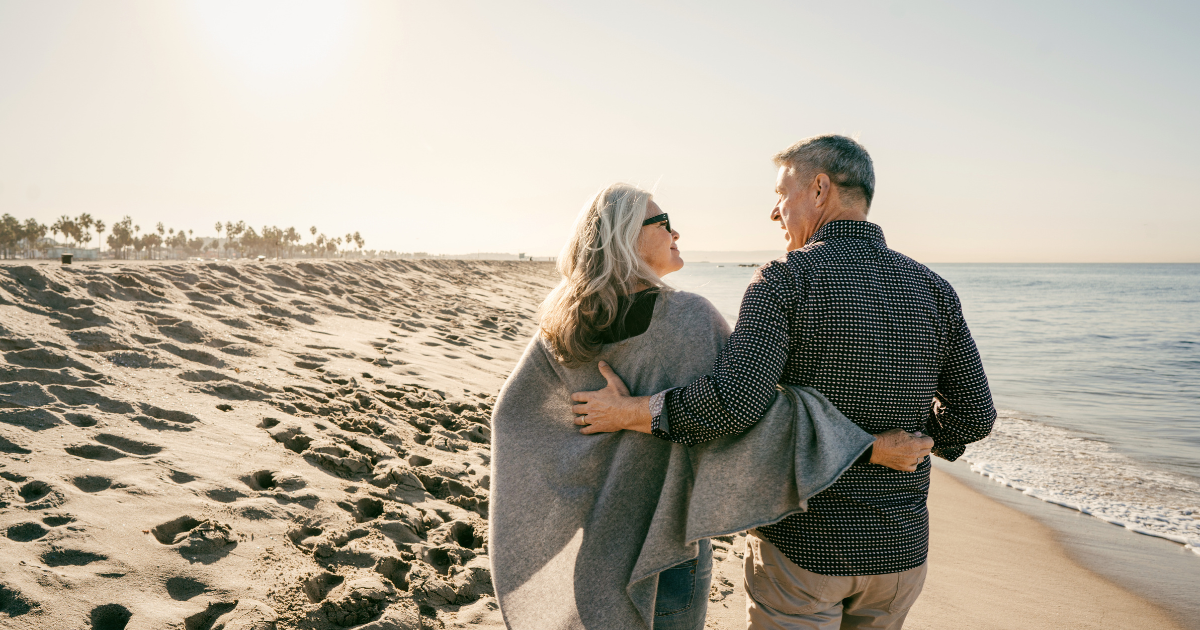 North County San Diego homeowners walking together on the beach
